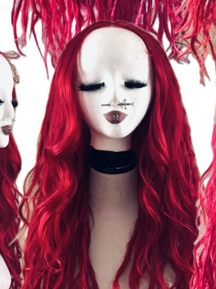 Red wig on a white mannequin head