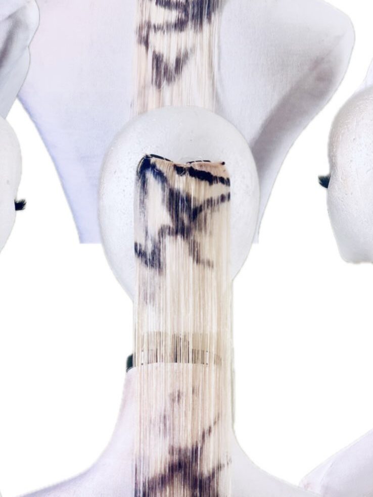 Hair extension: cream, ink marks